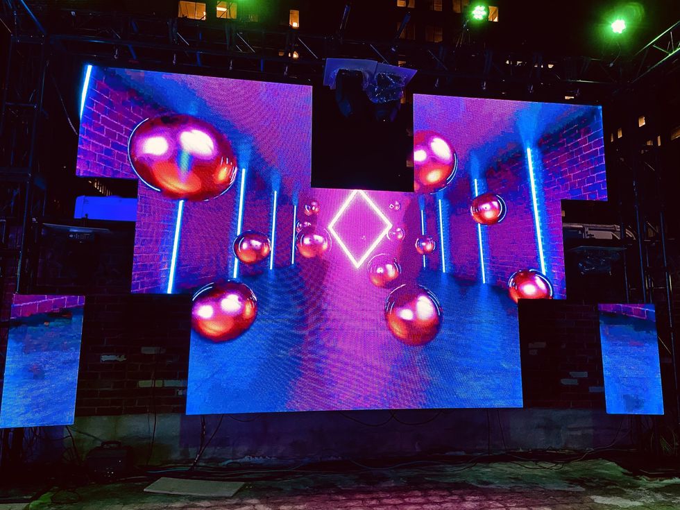 Futuristic light installation of geometric shapes in Bank Street's Snider Plaza.