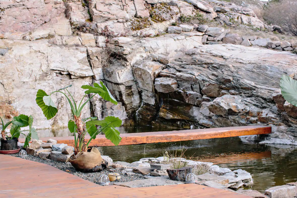 Garden and bridge water feature outside of the main home.