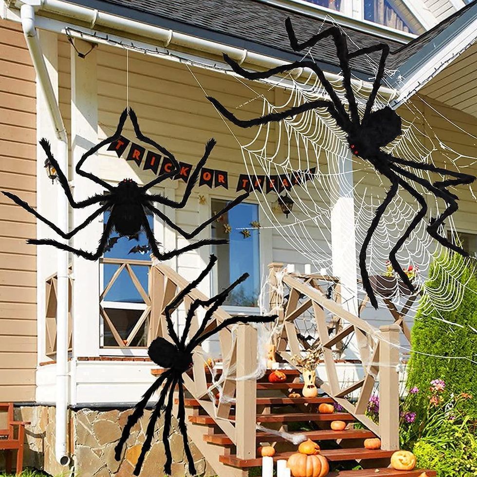 Giant spiders placed on a front porch.