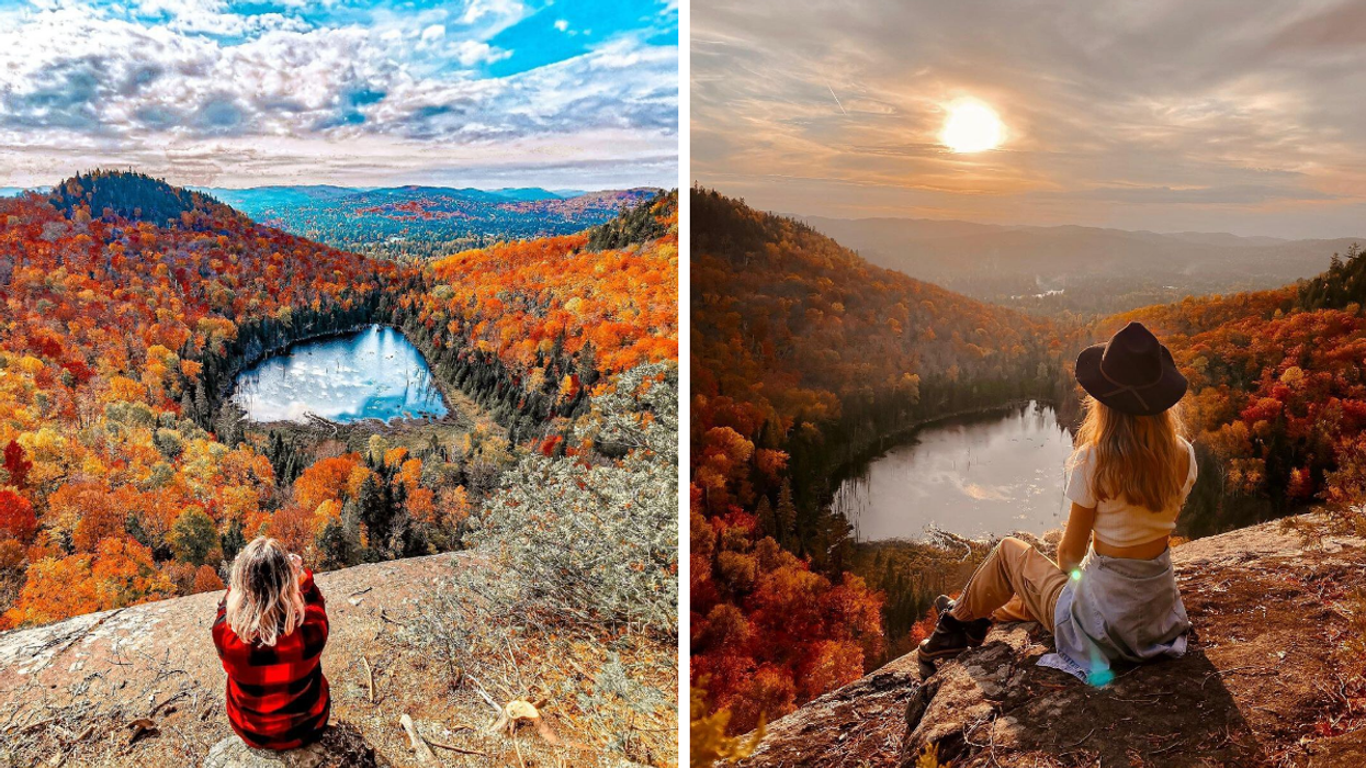 Girl looking over a blue lake and vibrant fall colours from a hike lookout.