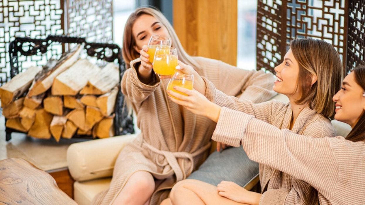 Girls holding drinks.