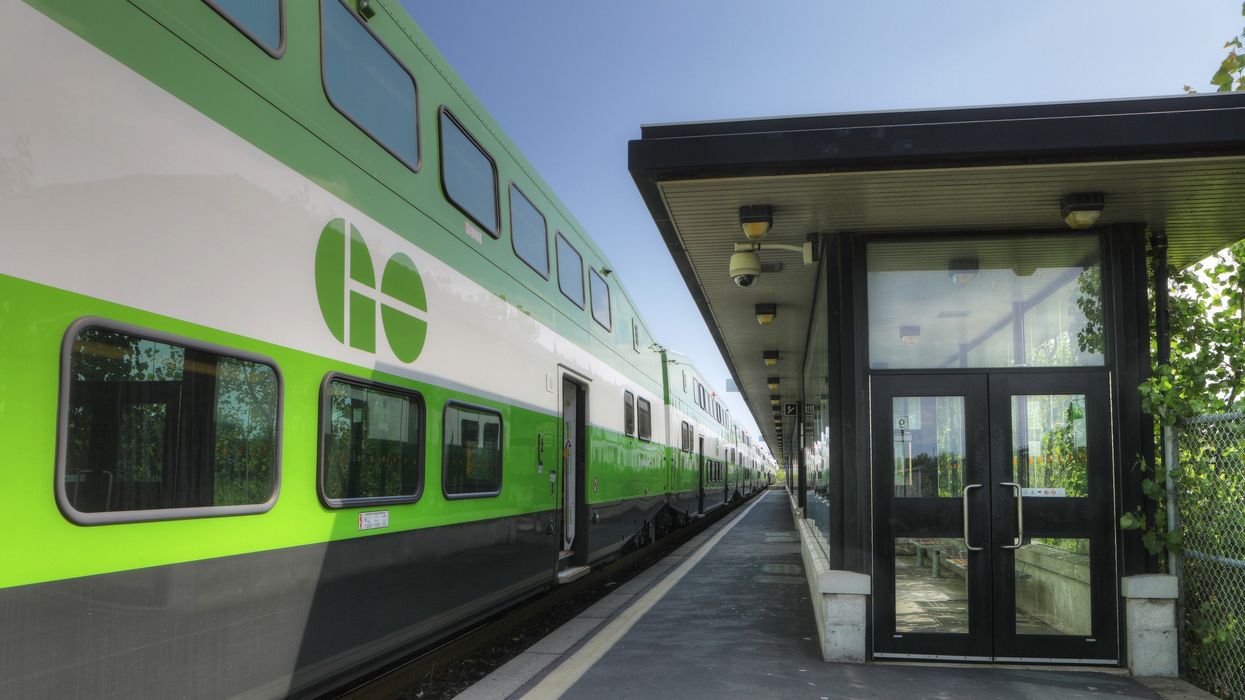 go train on the tracks at a station in ontario