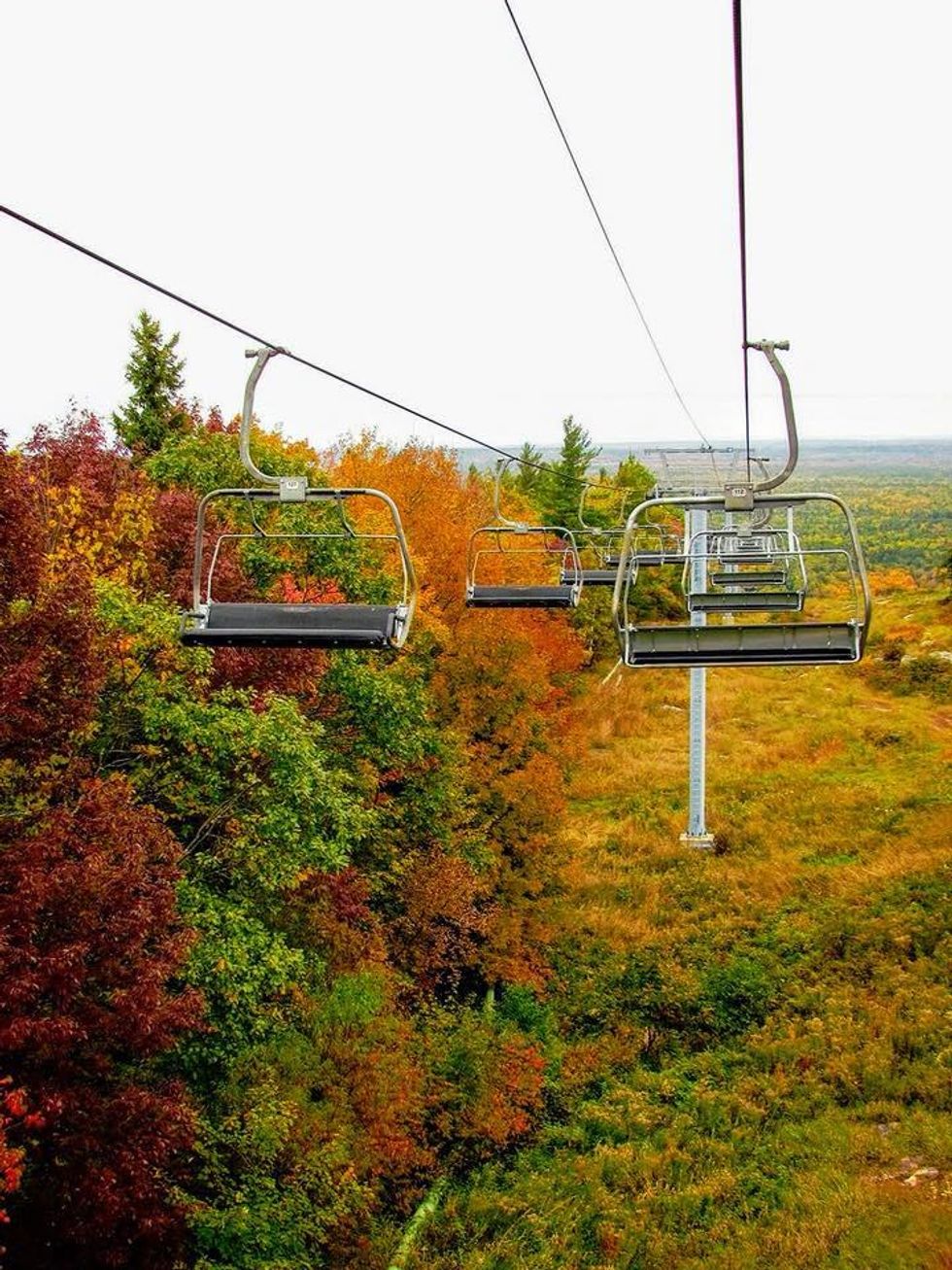 Gondola chairlift ride over fall colours at Calabogie Peaks Resort.