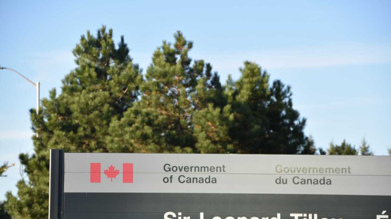 government of canada building sign in front of trees