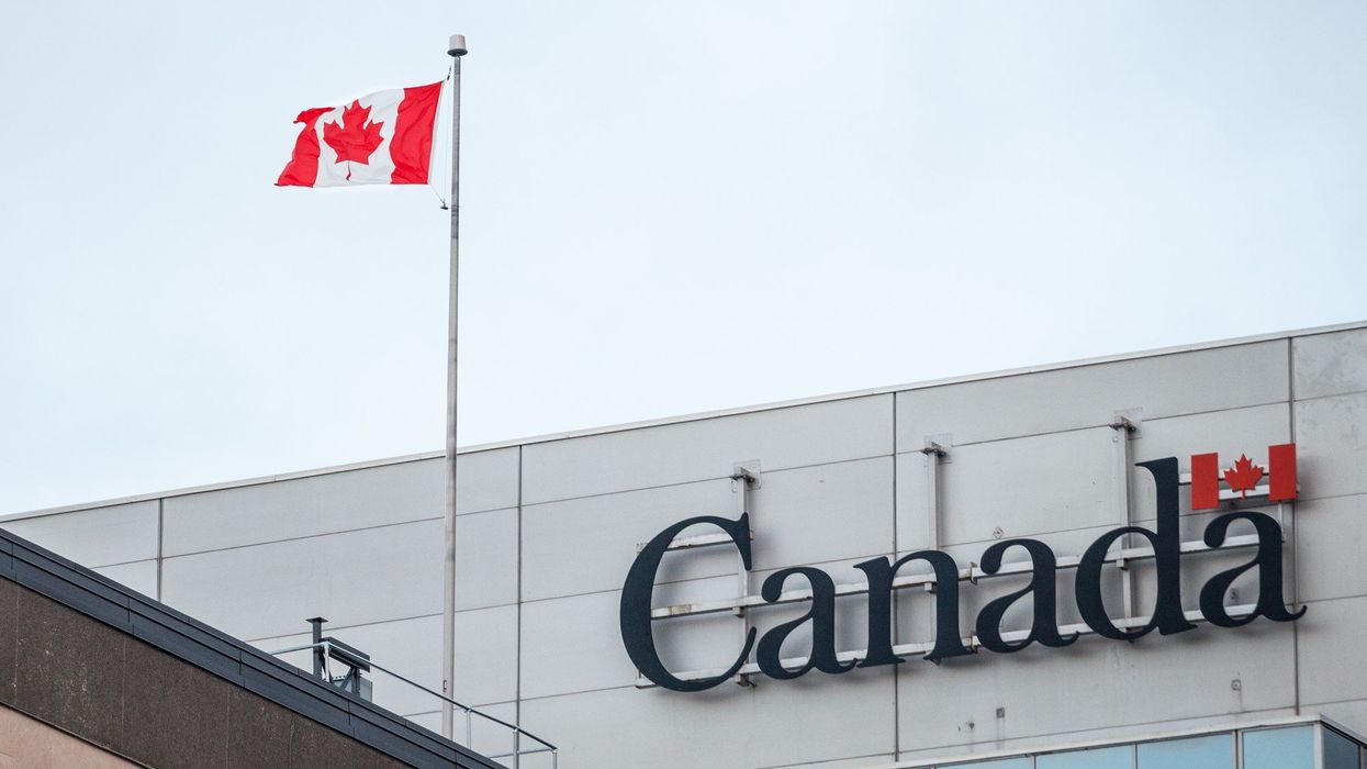 Government of Canada building with a Canadian flag.