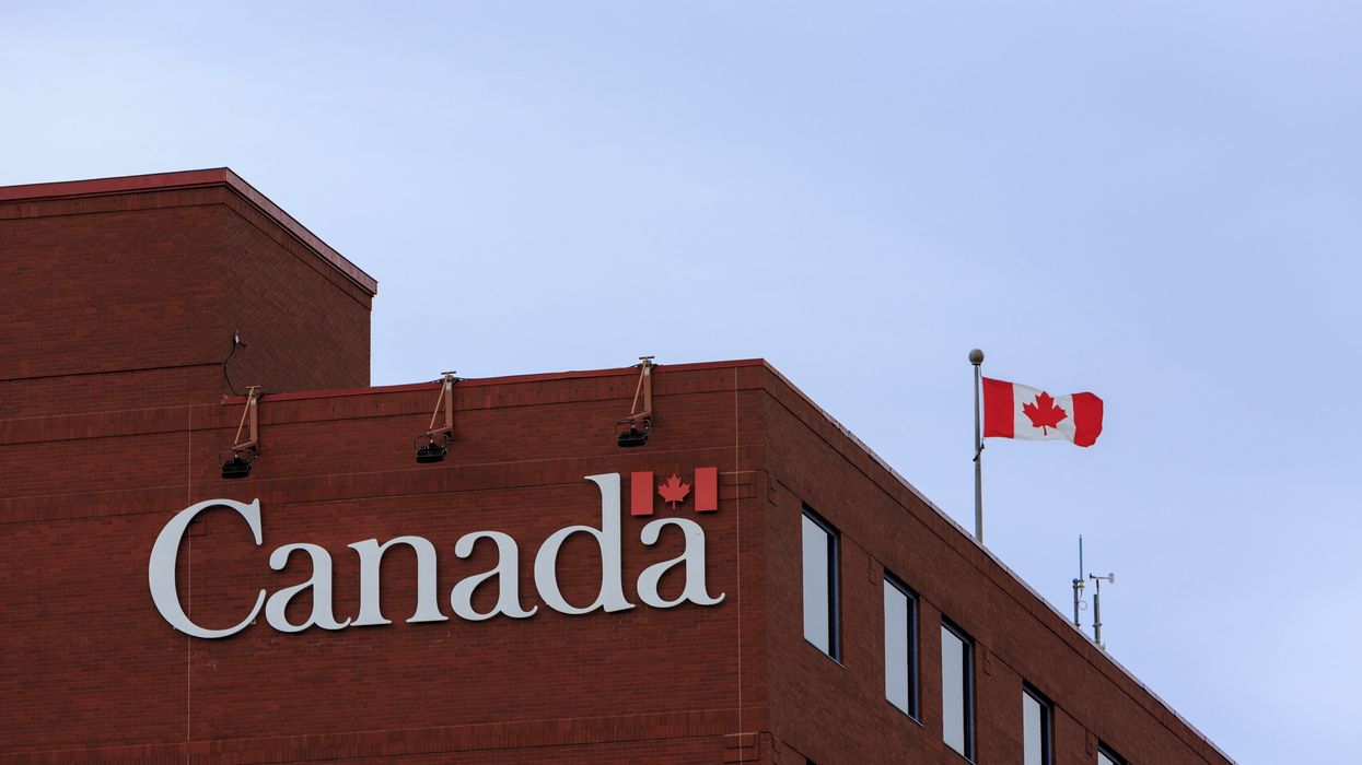 government of canada building with canadian flag