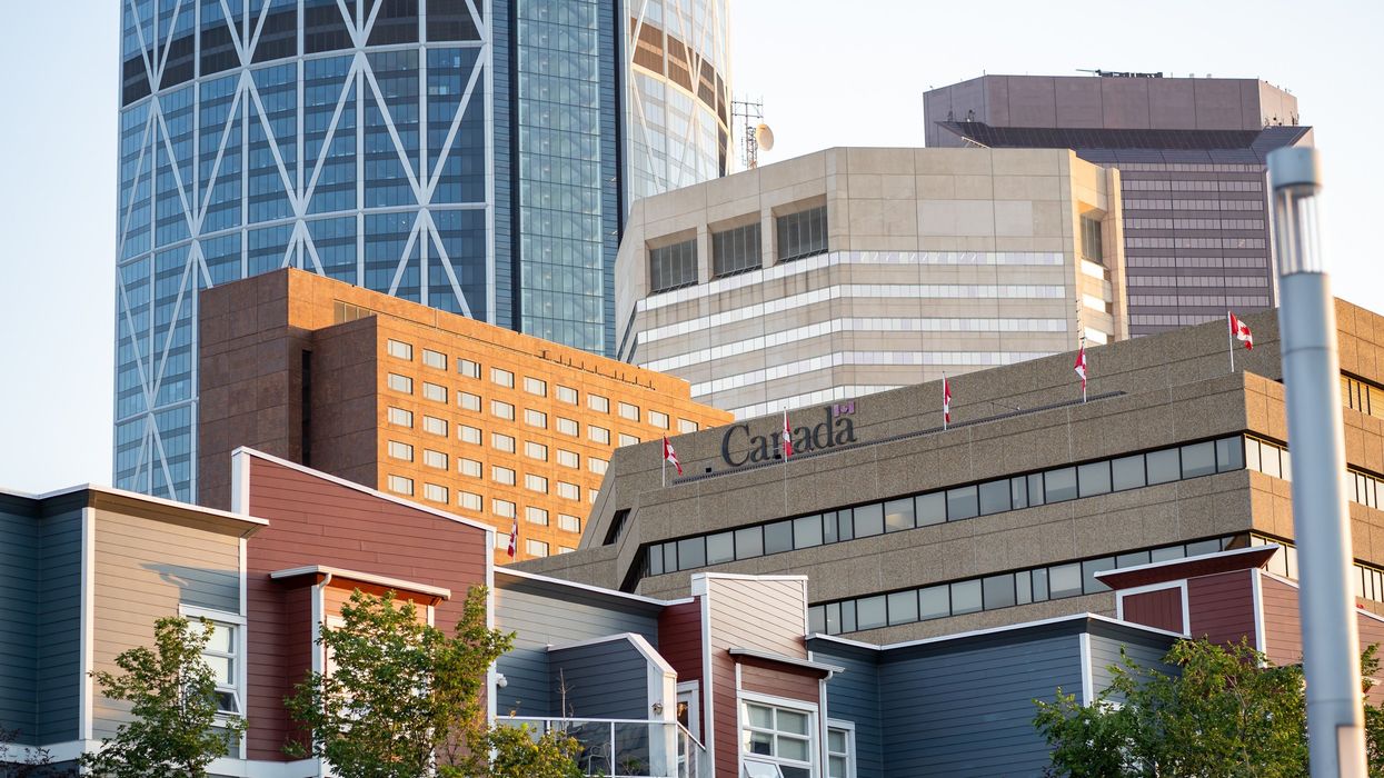 government of canada building with sign and canadian flags