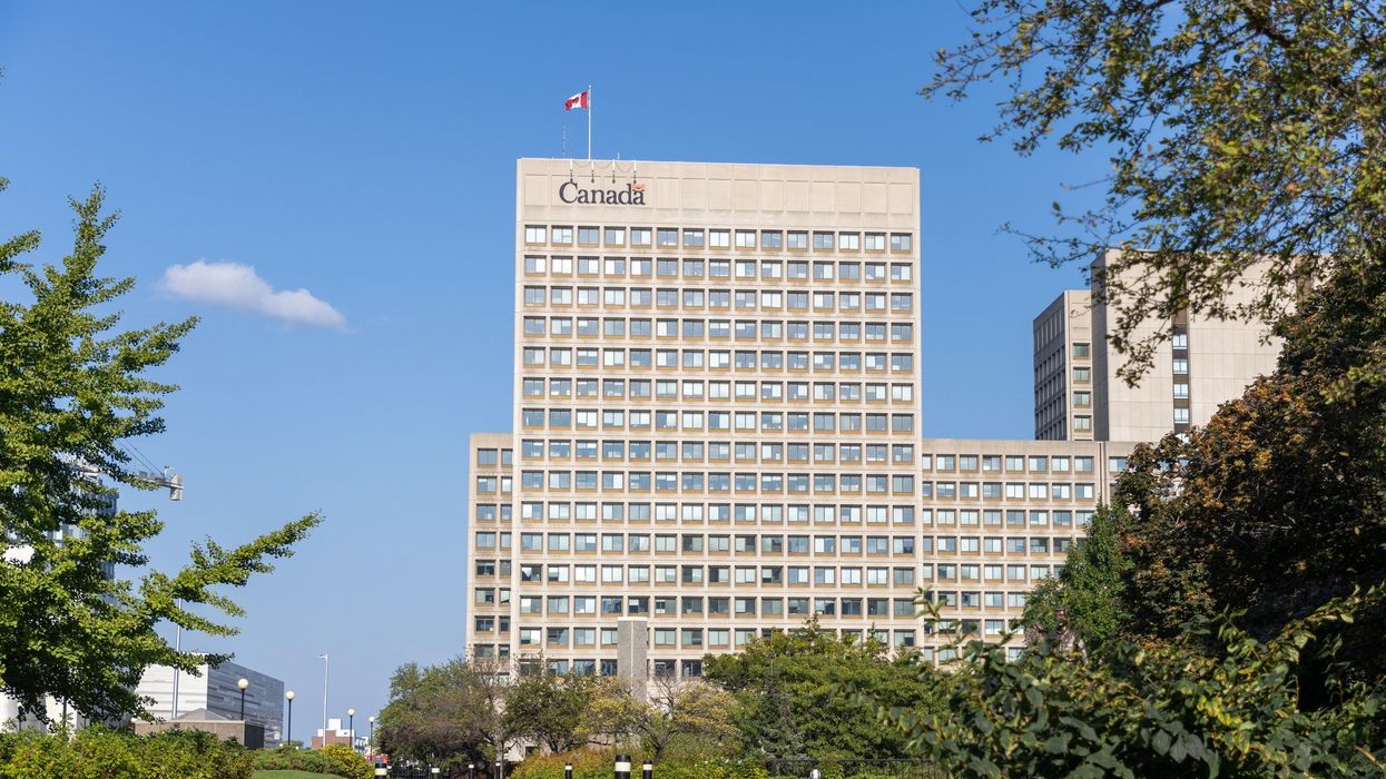 government of canada office building with canadian flag and logo