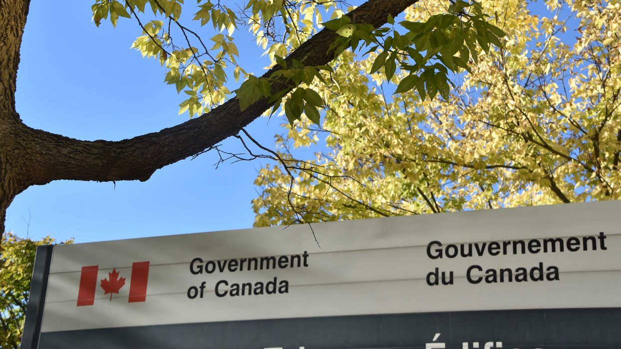 government of canada sign in front of trees