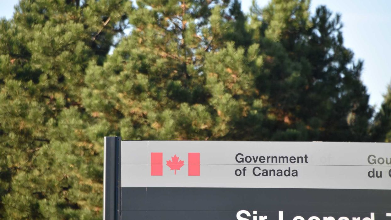 government of canada sign in front of trees