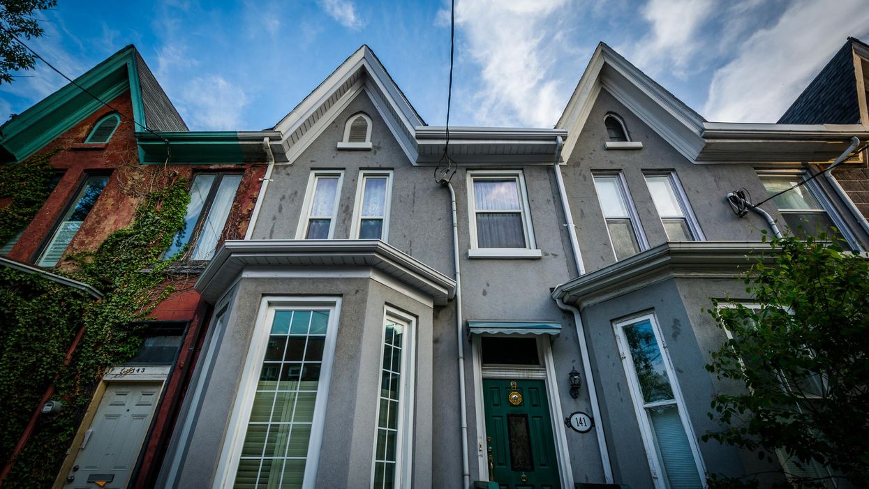 Grey houses in a Toronto neighbourhood.