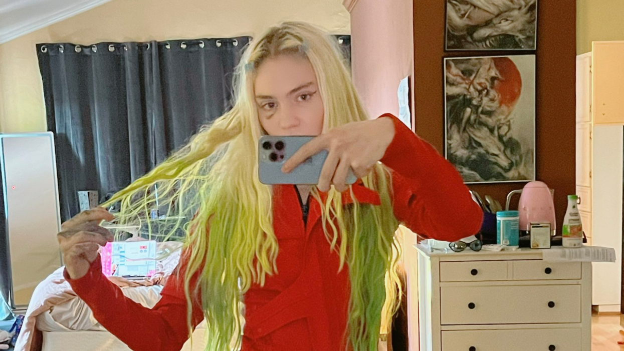 Grimes taking a selfie.