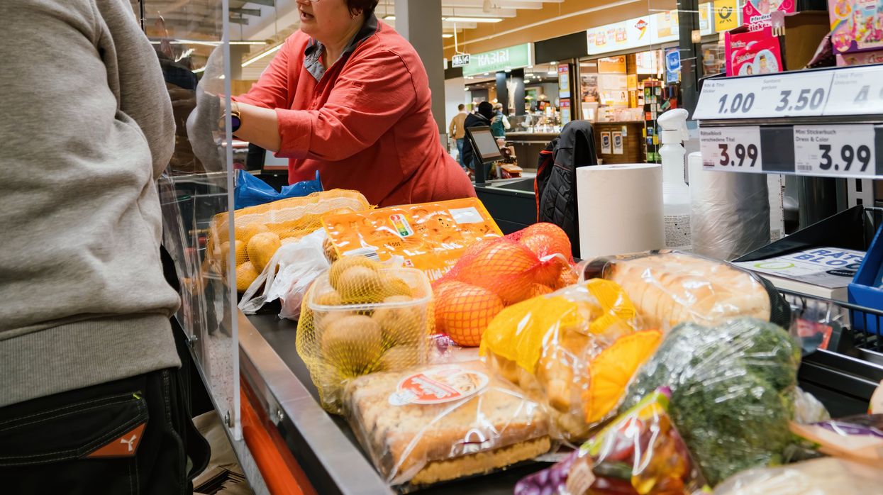 Groceries being checked out at a grocery store.