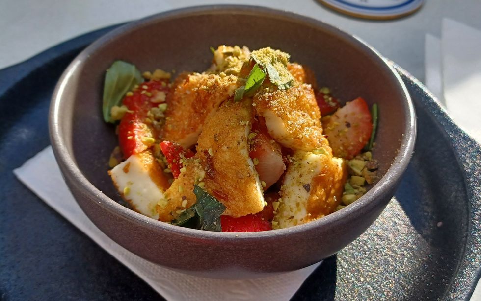 Grounded's "Halloumi"; fried halloumi, grounded pistachios, fresh strawberries, mint leaves with a hot-honey drizzle.