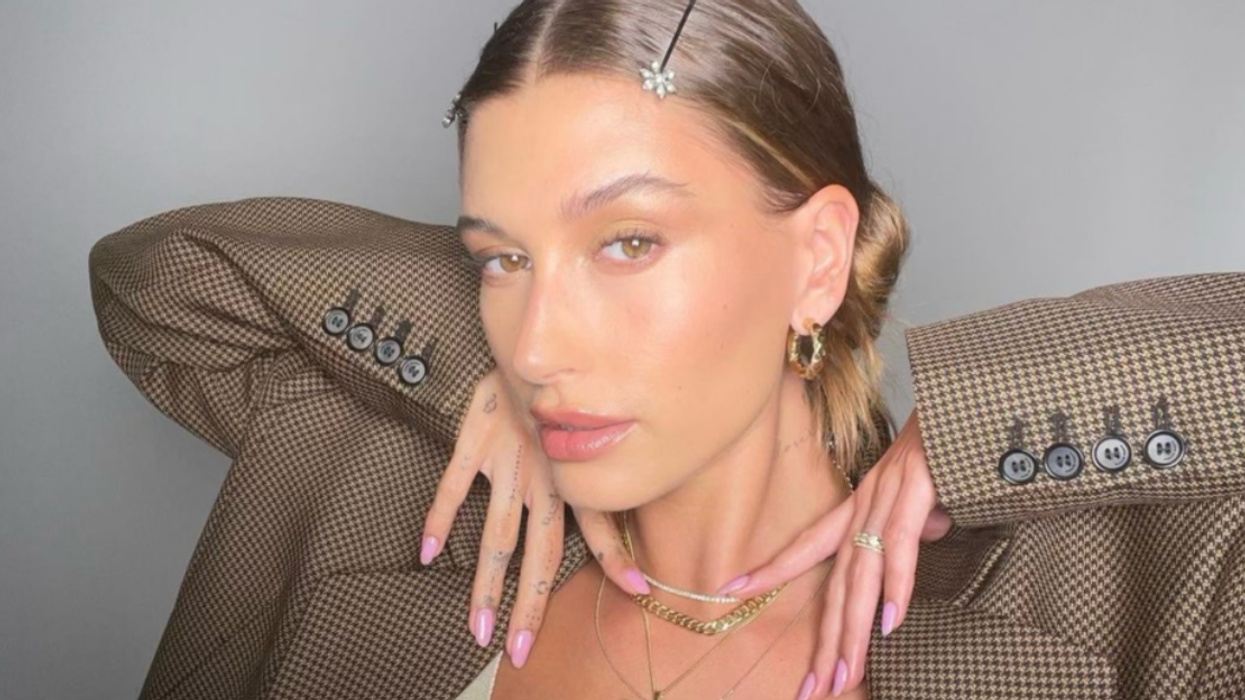 Hailey Bieber with a dewy makeup look.