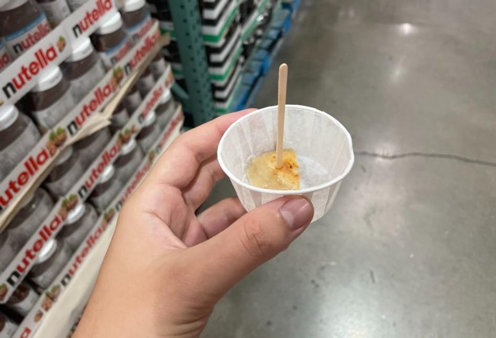 Half of a pierogi in a cup.