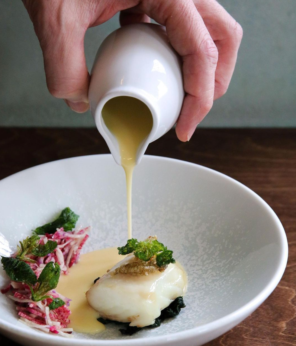 Halibut with radishes, stinging nettles & citrus-smoked butter sauce from St. Lawrence.