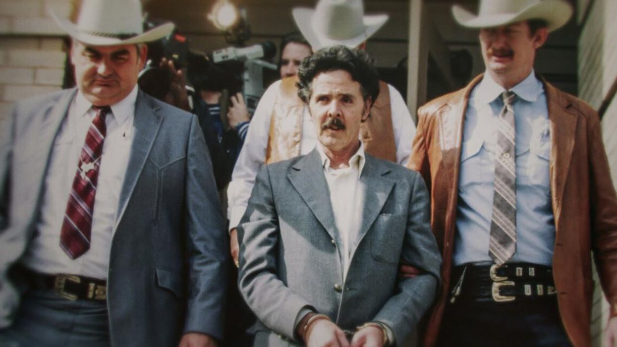 Henry Lee Lucas in handcuffs.