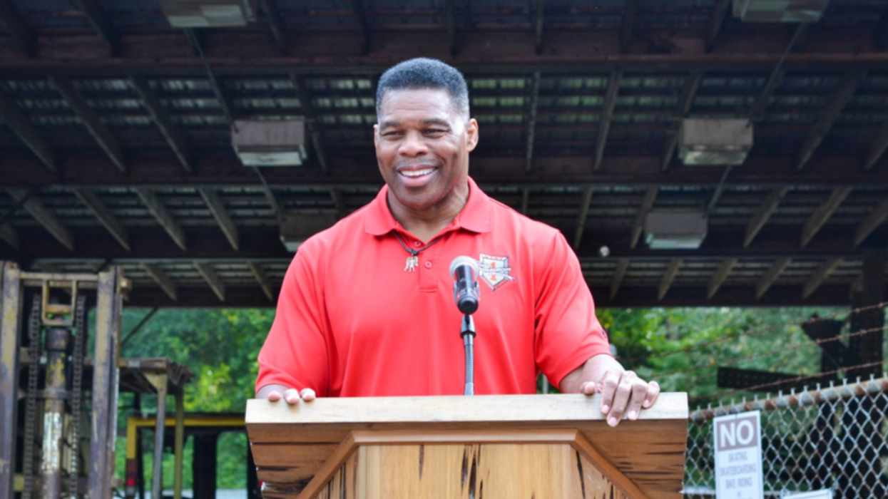 Herschel Walker at a podium.