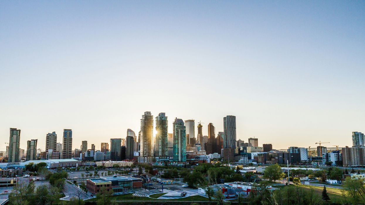 high-rise buildings in calgary with the sun shining in between