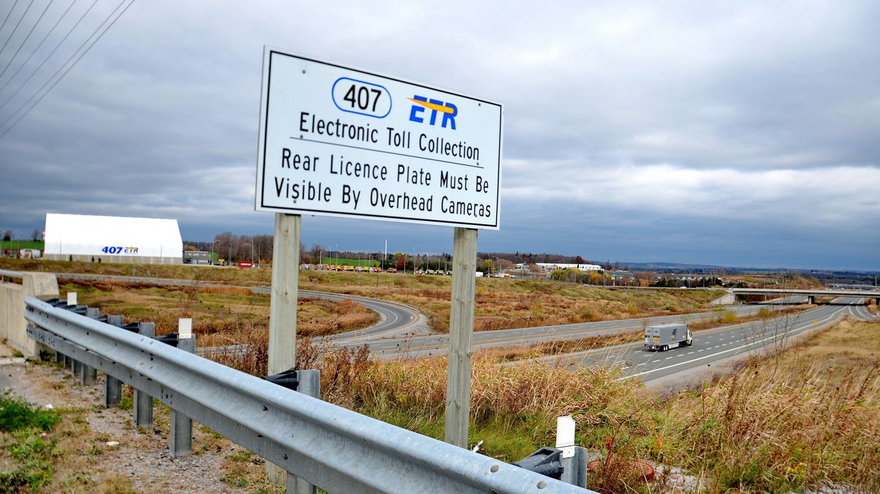 Highway sign reading "407 ETR, Electronic Toll Collection."