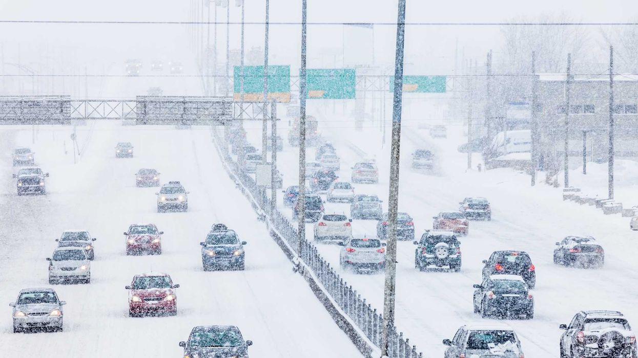 Highway traffic on a snowy winter day.