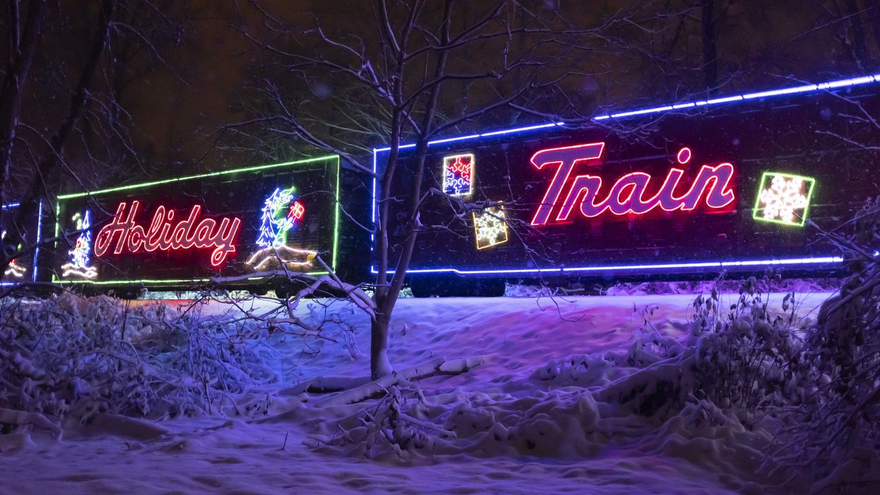 holiday train on tracks lit up at night