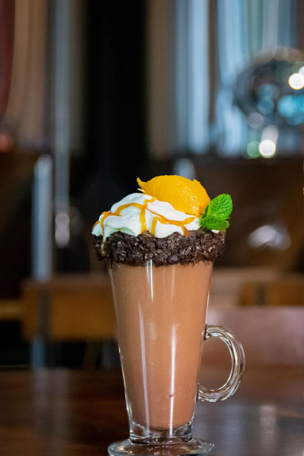 Hot chocolate with whipped cream and garnish.