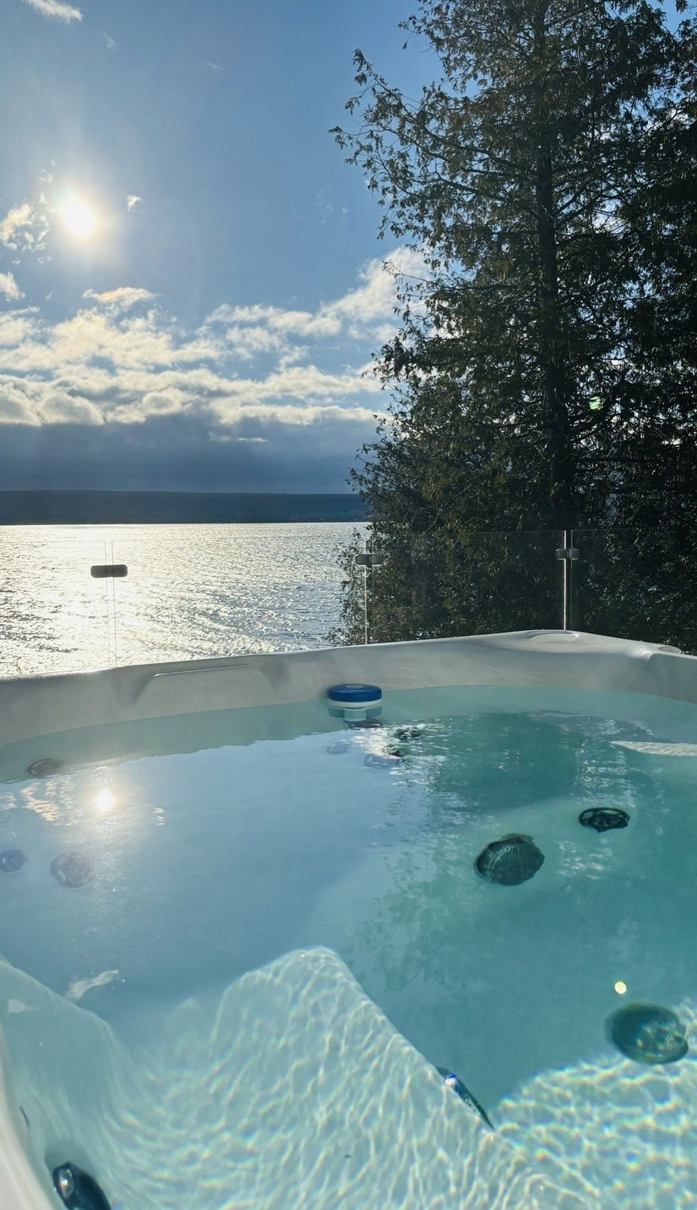 Hot tub overlooking the water.