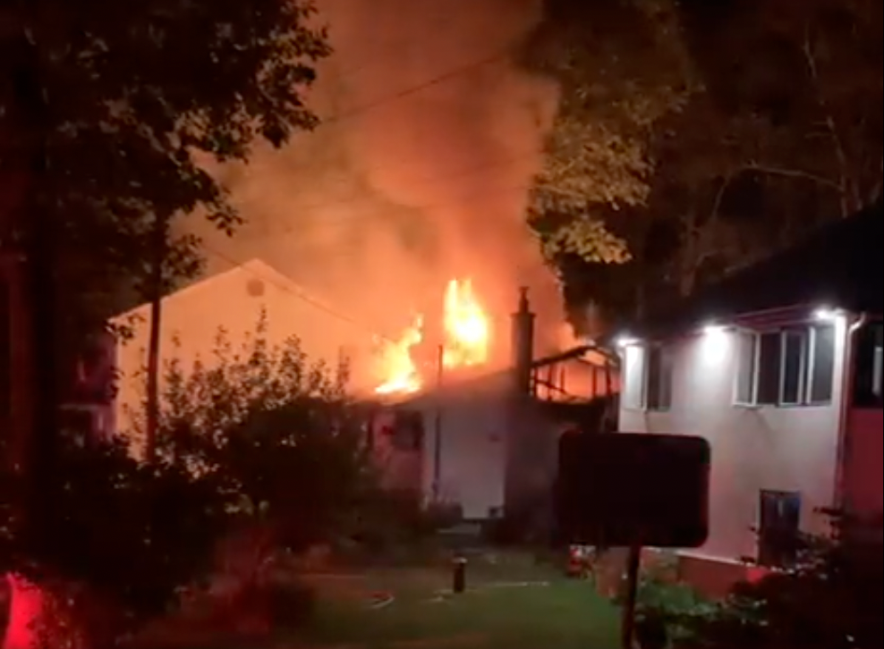 House engulfed in flames.