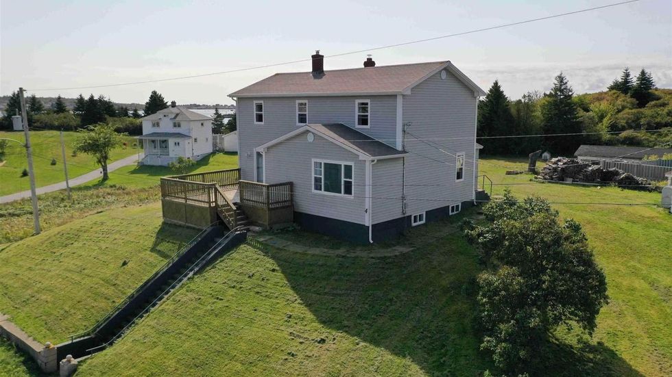 House for sale in Nova Scotia with a staircase to the water.
