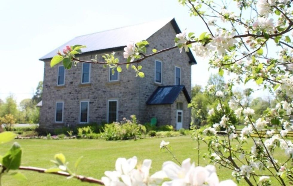 House surrounded by blossoms.