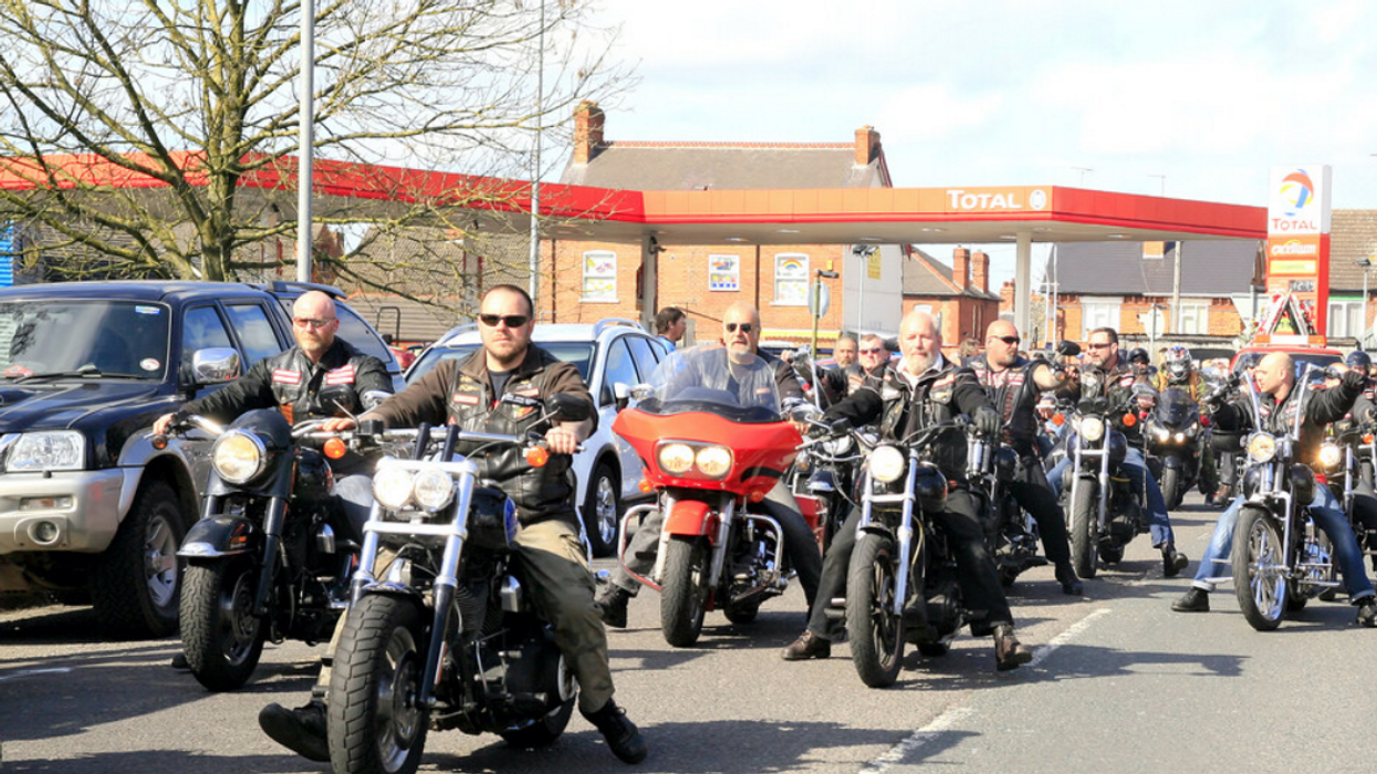 Hundreds of Hells Angel bikers in a funeral procession for a chapter president.