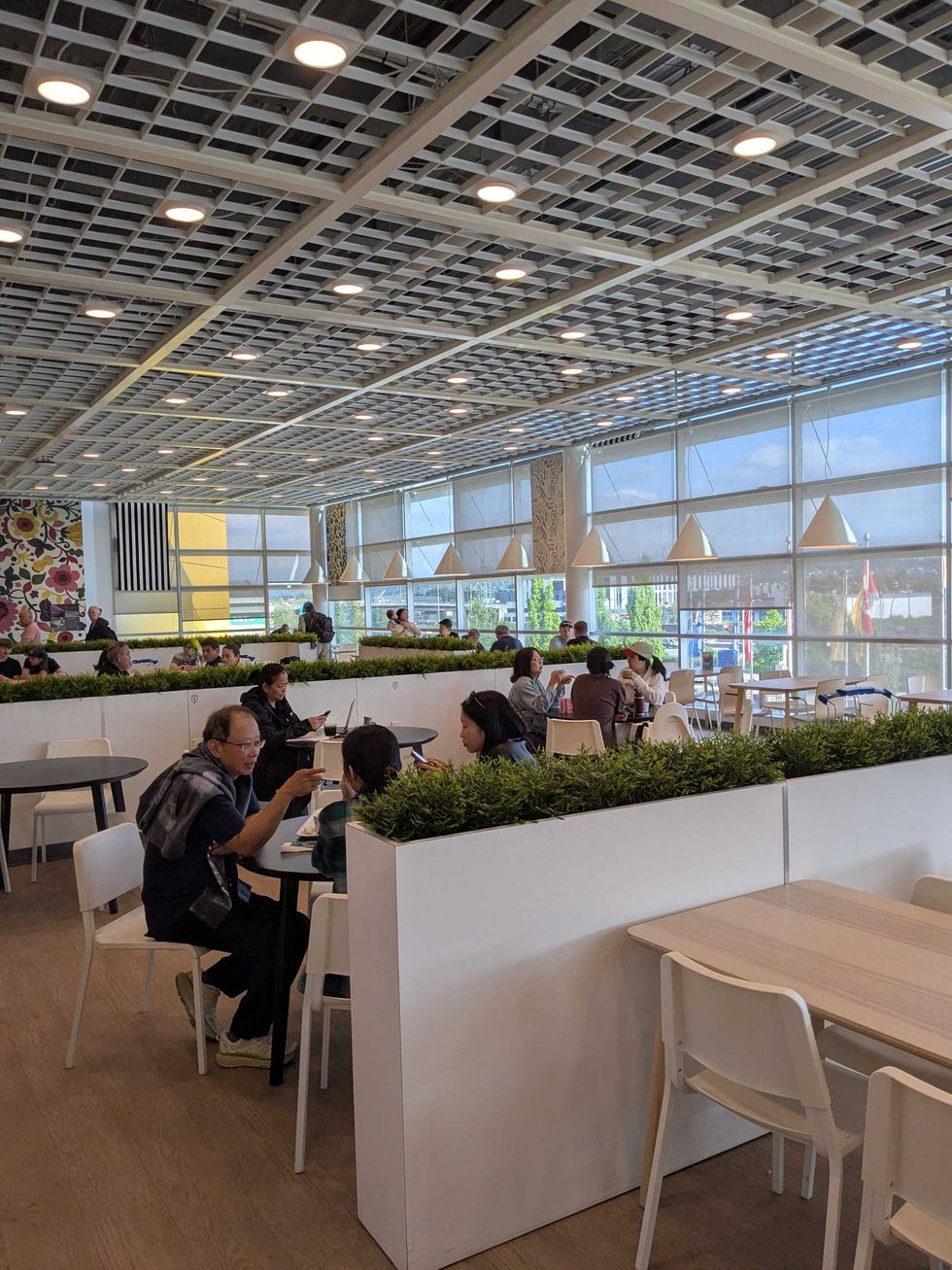 IKEA dining hall with people sitting around tables eating