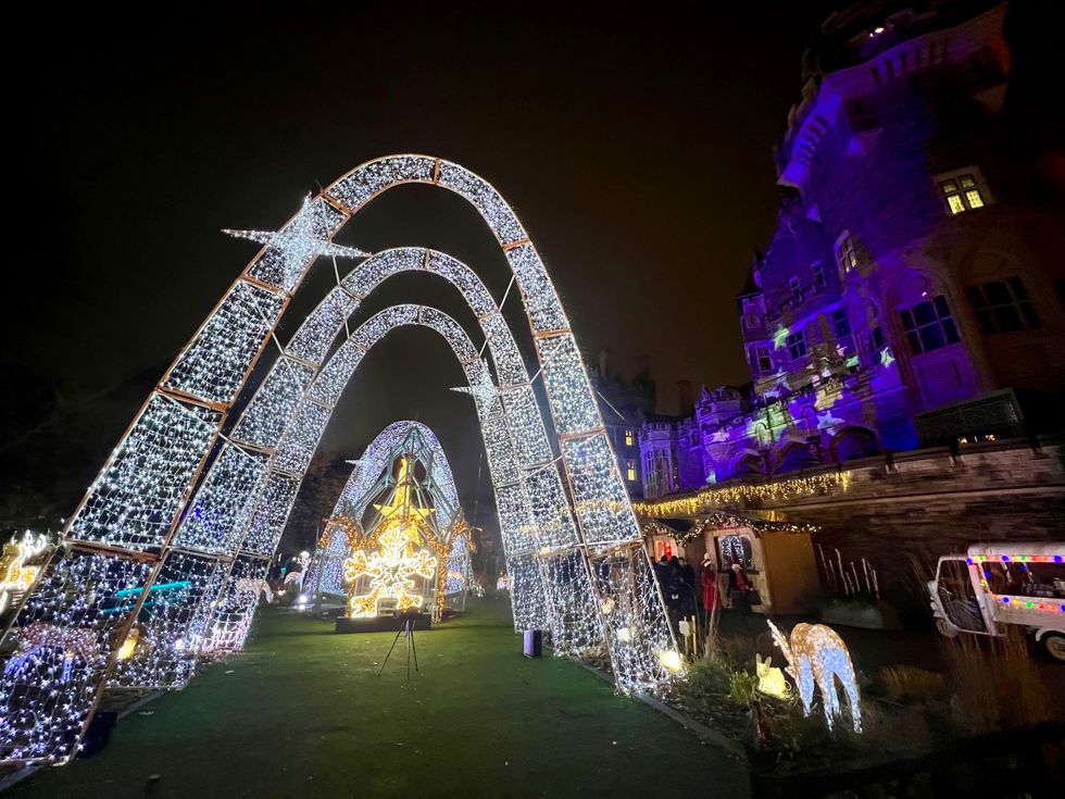 Illuminated archways by the castle.