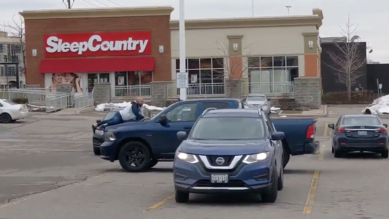 A Toronto Man Jumped Onto A Moving Car After It Reportedly Hit His Parked Vehicle (VIDEO)