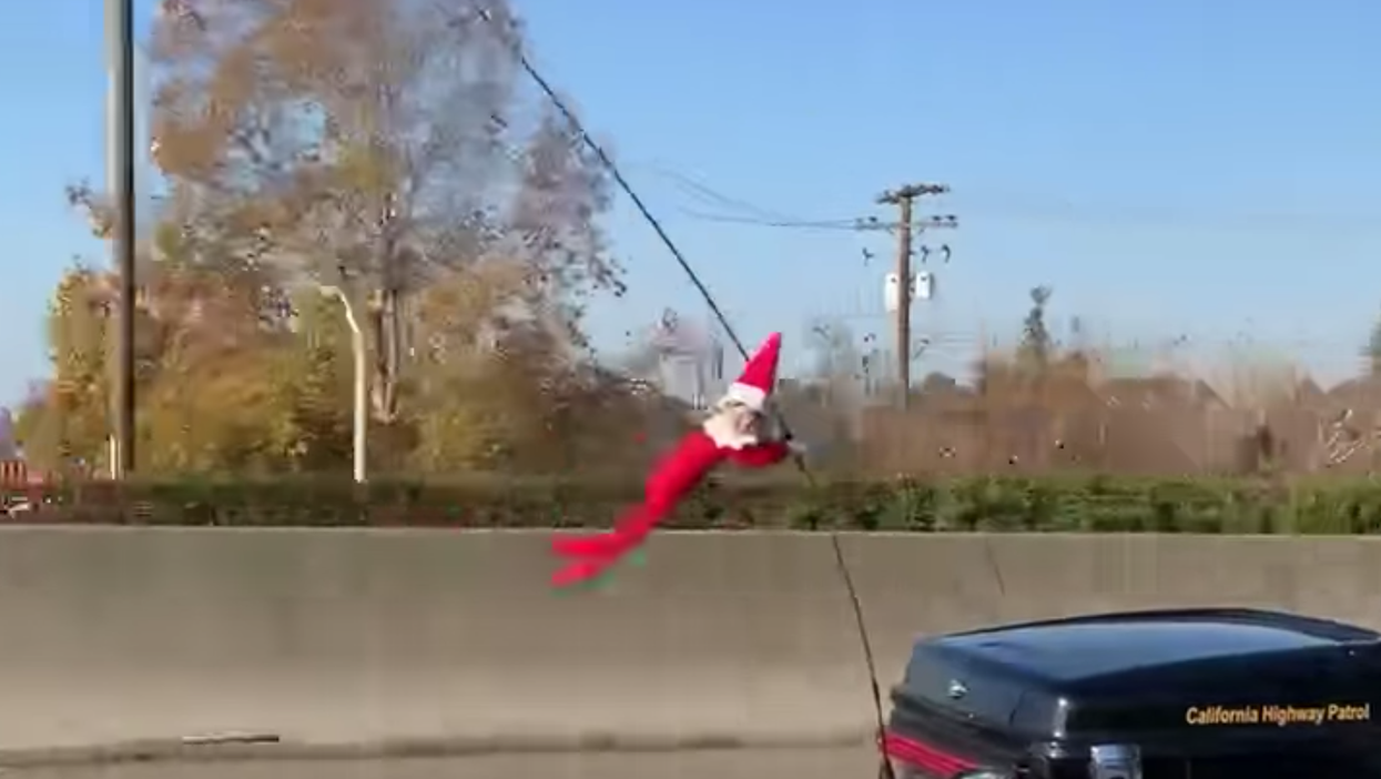 Elf On A Shelf Seen Clinging To California Cop's Motorcycle Like A Small Criminal (VIDEO)