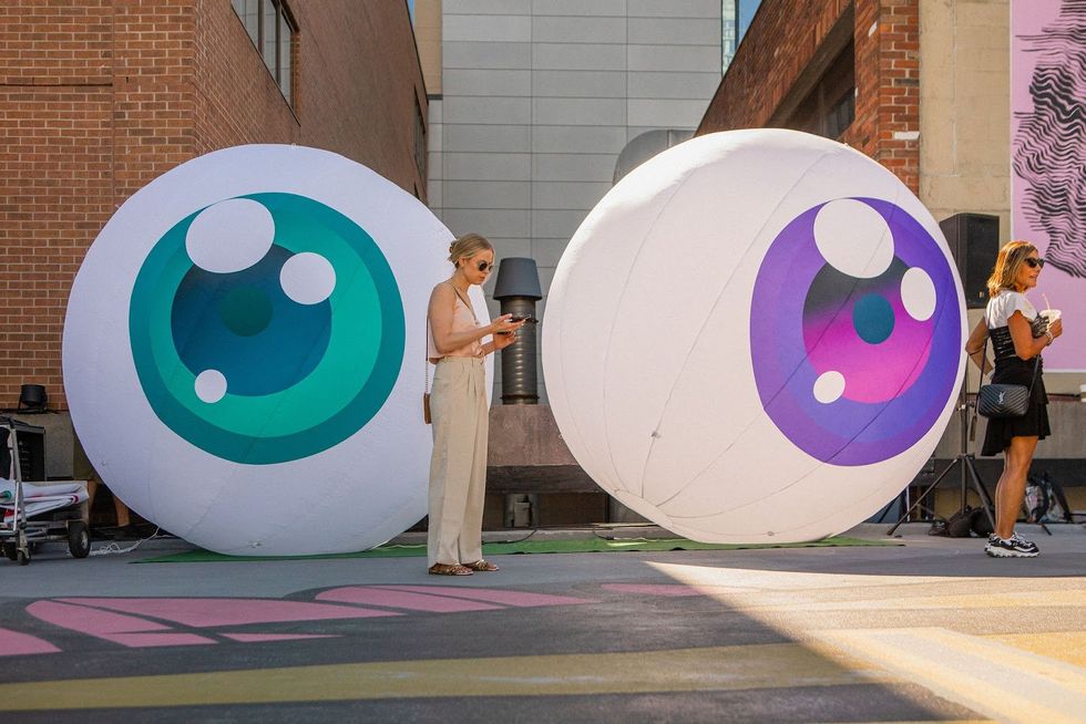 Inflatable eyes at Yorkville Murals.