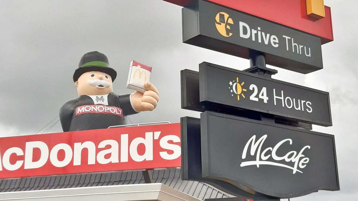 inflatable monopoly man at exterior of a mcdonald's restaurant