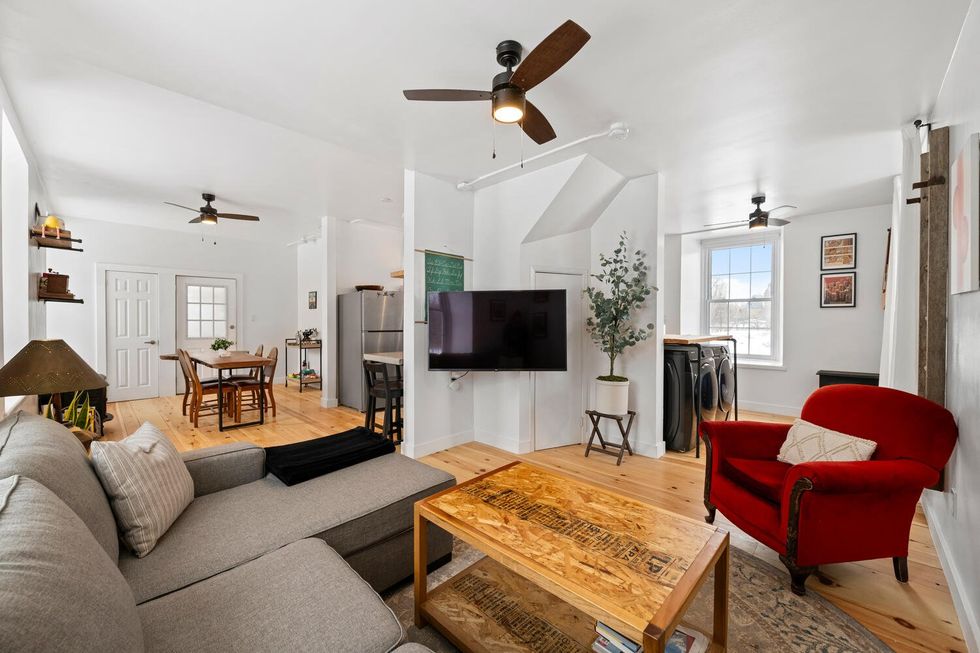 Interior of a home with a sitting area and dining room.