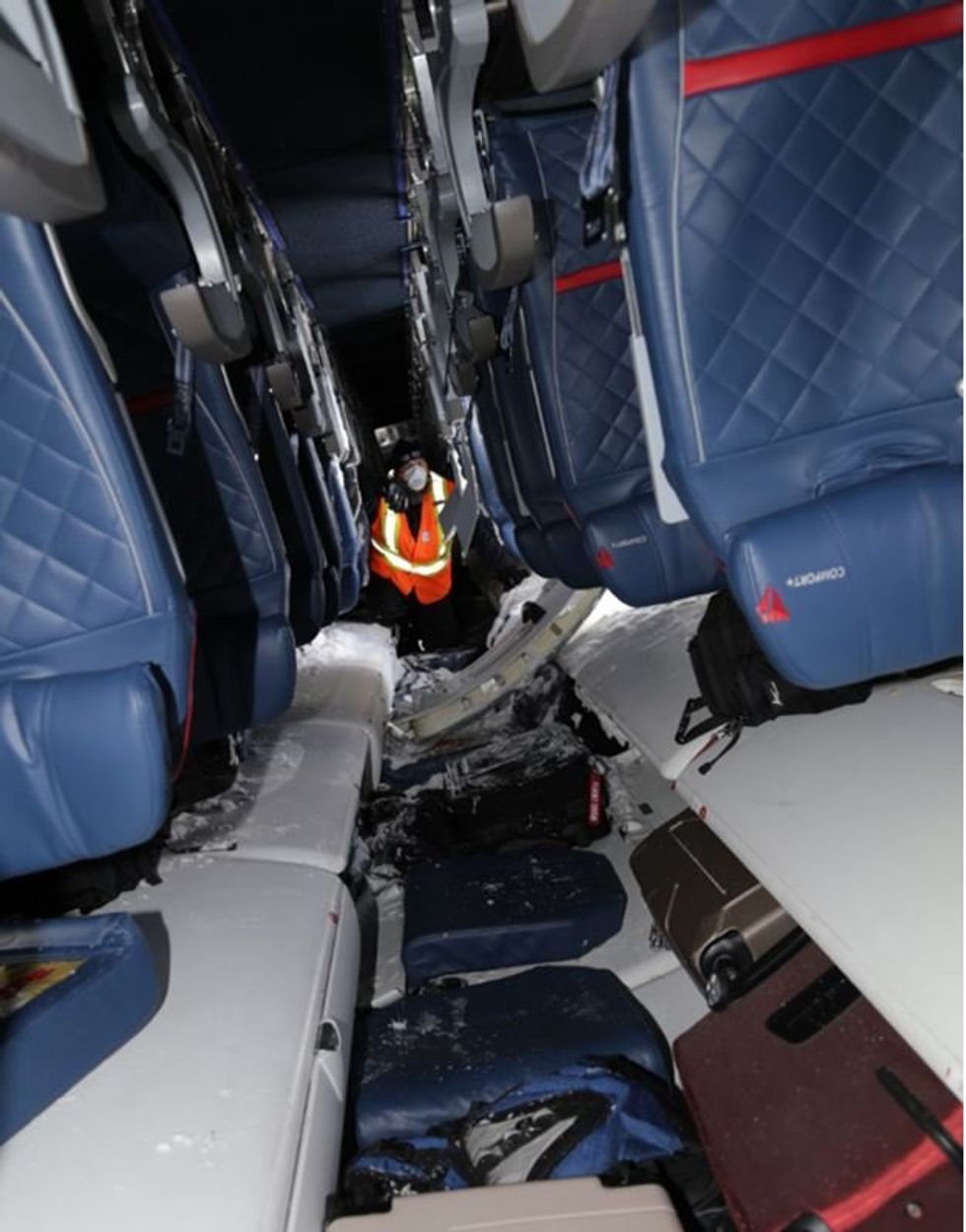 Interior of aircraft cabin at the occurrence site, looking aft.