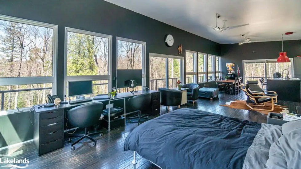 Interior of the home with an office space and bed.