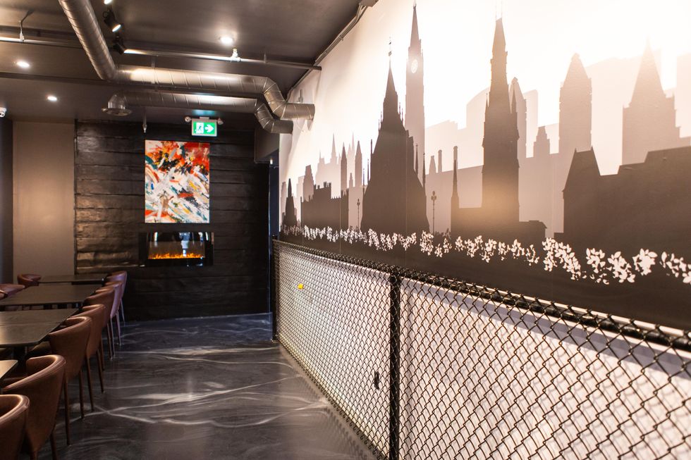 Interior view of J'TM Resto Bar restaurant in Ottawa with love lock wall.