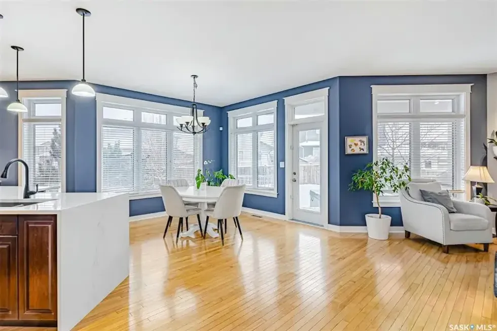 Interior wall of the Saskatoon home filled with windows.