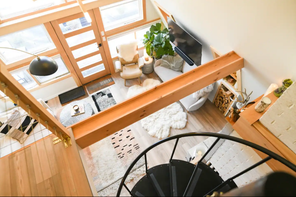 Interior with a spiral staircase and television.