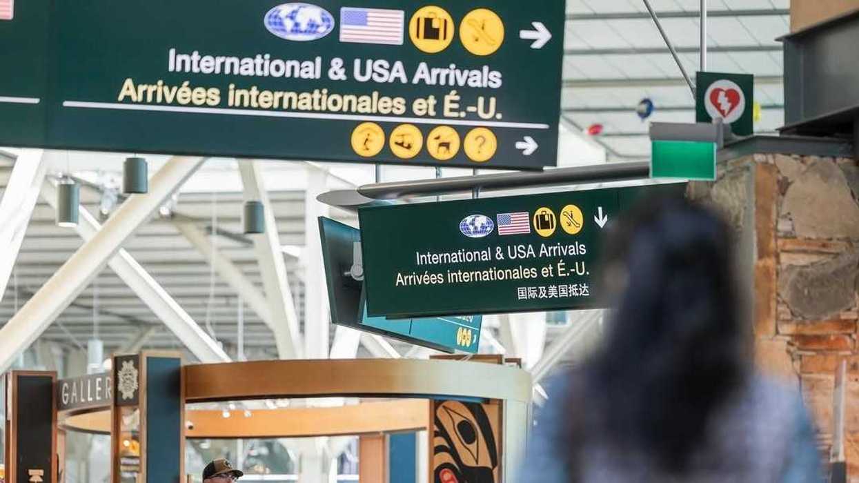 international and usa arrivals signs at vancouver international airport