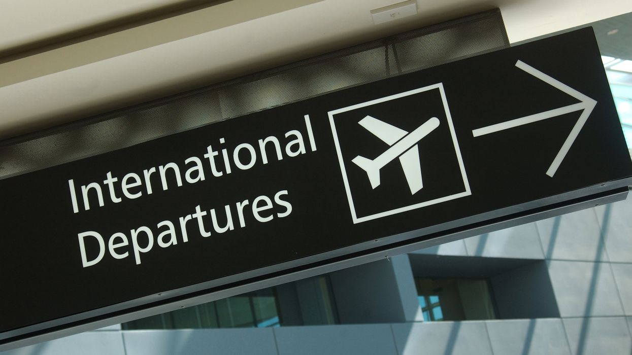 International departures sign at an airport.