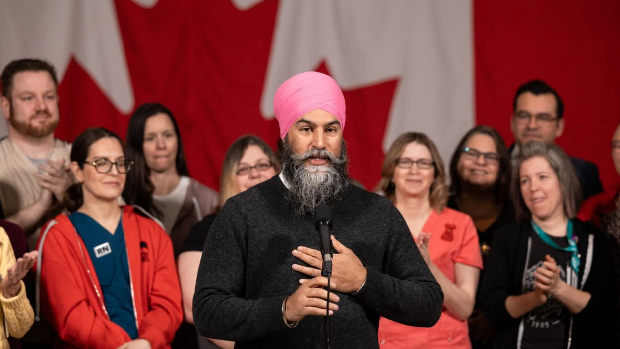 Jagmeet Singh, with his hand on his heart, delivers an emotional speech to supporters.