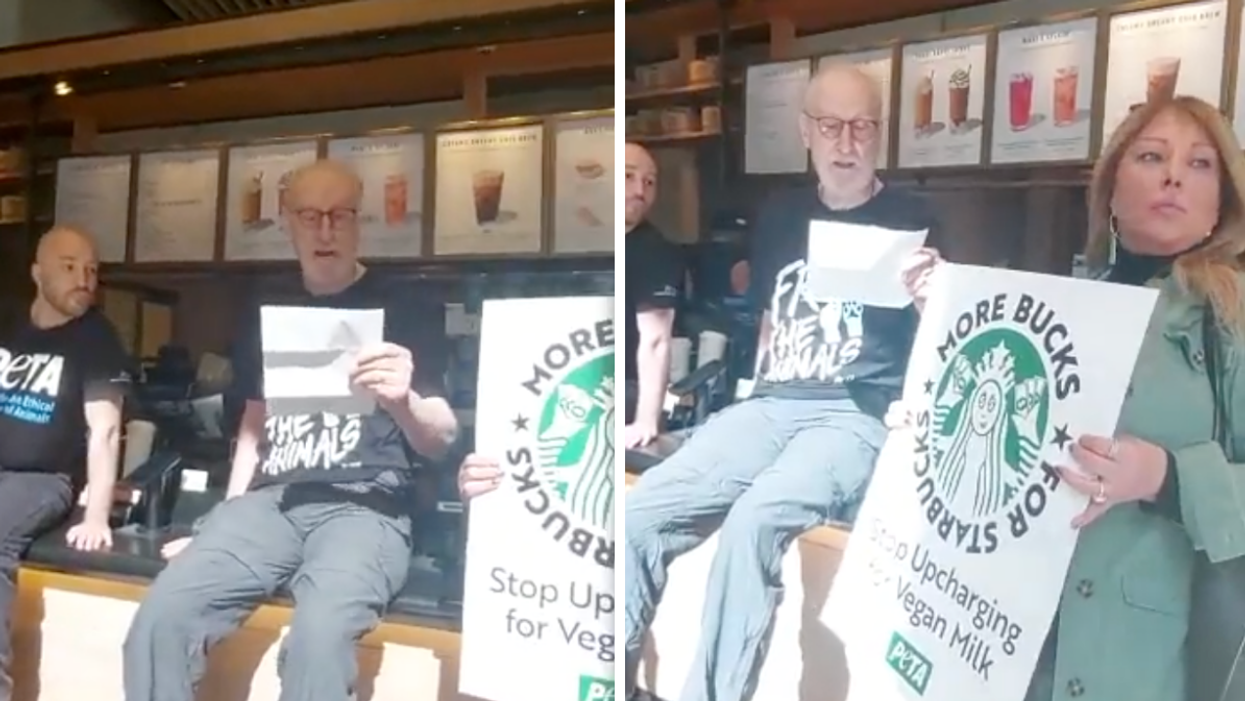 James Cromwell sitting on a Starbucks counter while someone holds up a sign that read 'More bucks for Starbucks'.