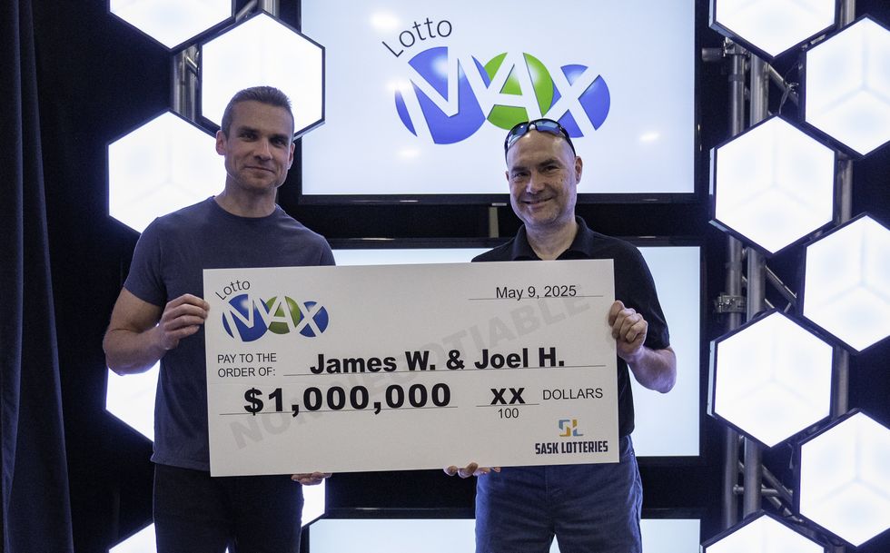 james wawryk and joel hedlin with a $1 million lotto max cheque